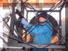 Patrick Wiggins bolts the truss tube to the mount.  03 DEC 2004